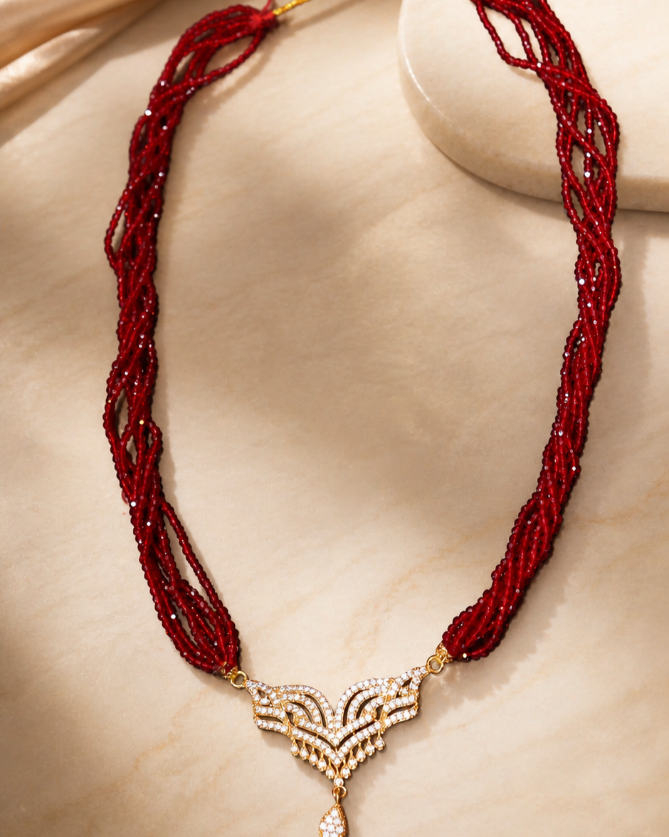 Gold-Plated American Diamond Mangalsutra with Multi-Strand Red Beads & Designer Pendant